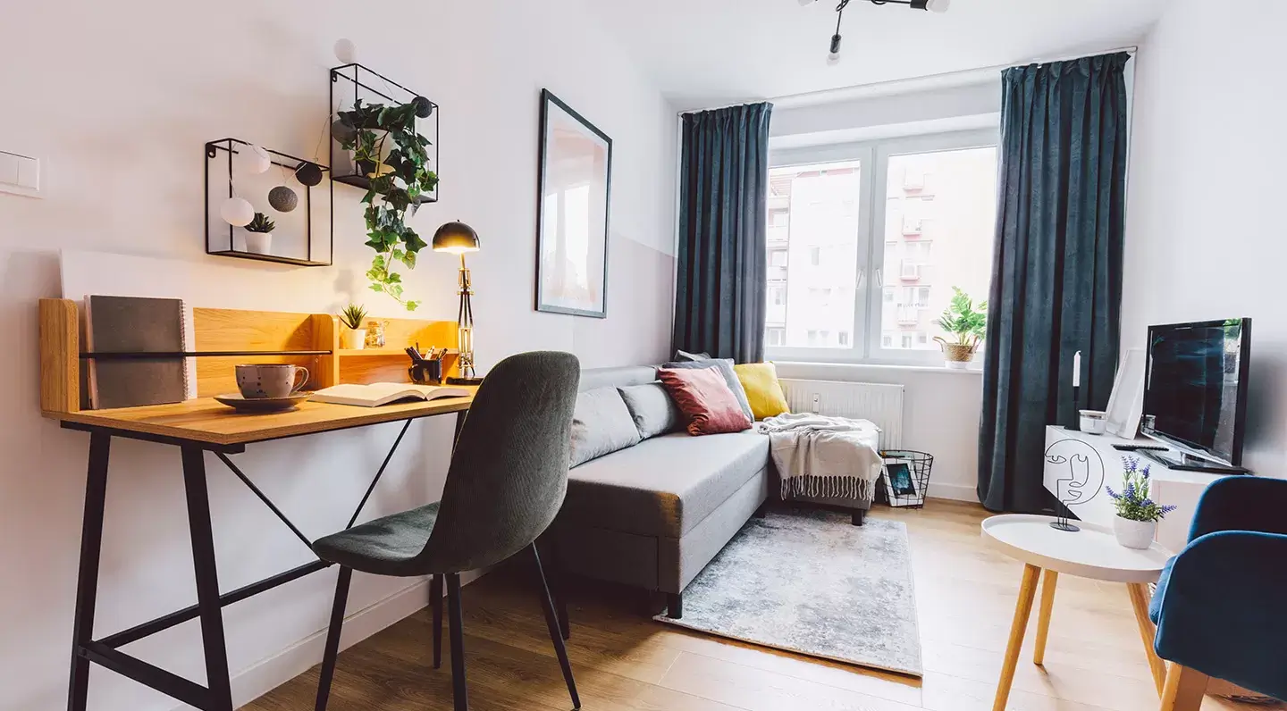 Compact apartment living space lit by a casement-style uPVC & Aluminium window